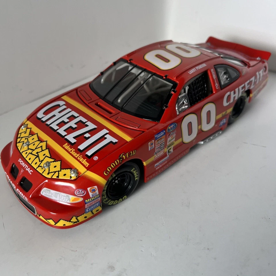 NASCAR ACTION Larry Pearson racing champions #00 Cheez It 1999 Pontiac 1:24  - Image 1 of 4