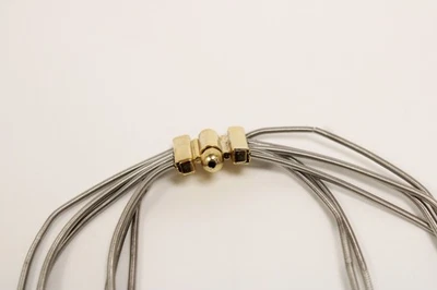 collana bigiotteria con sfere colore oro su catena multicolore colore argento - Immagine 1 di 4