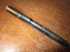 An old fountain pen with  14 ct gold nib - brass clip