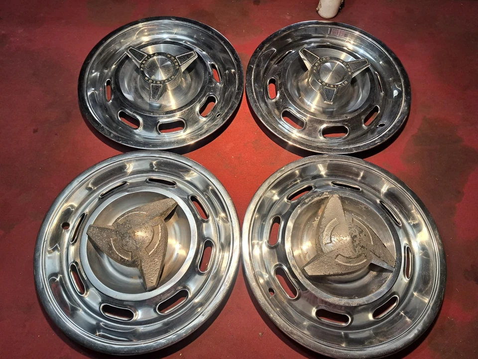 Pontiac GTO 1964 Lemans Tempest tapacubos giratorios juego de 4 cubiertas de rueda originales Foto 1 de 3