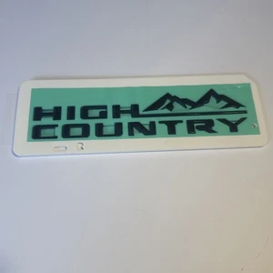 GM 2019-2026 lado derecho High Country elevado brillo negro emblema - Imagen 1 de 4