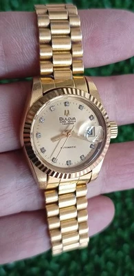 VINTAGE BULOVA SUPER SEVILLE CALENDAR AUTOMATIC GOLD TONE LADIES SWISS WATCH - Image 1 of 4