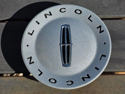 Tapa central de rueda Lincoln LS 2003-2005 plateada 3W43-1A096-AB OEM Foto 1 de 4