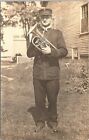 RPPC Musician Posing with His Brass Instrument outside Home early 1900s