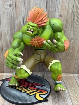 Figura de acción Resaurus Toys Street Fighter Ronda 1 Blanka con base Foto 1 de 4