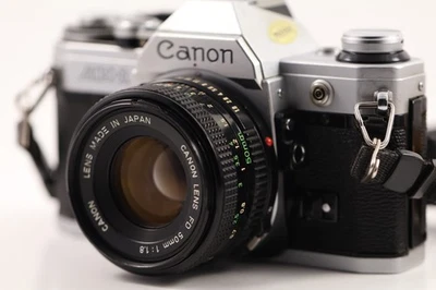 Canon AE-1 35mm SLR Film Camera w/ Canon 50mm 1:18 Lens TESTED - Image 1 of 4