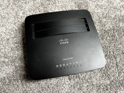 CISCO LINKSYS X1000 WIRELESS ADSL2+ MODEM ROUTER ANNEX B - SCHWARZ TOP! - Bild 1 von 4