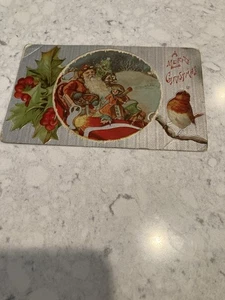 Antique Postcard/Santa And His Sleigh  Holly And Red Bird “A Merry  Christmas” - Picture 1 of 3