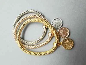 Set Of Three Stretch Bracelets Gold-Gold Rose-Silver With Charm E - Picture 1 of 4