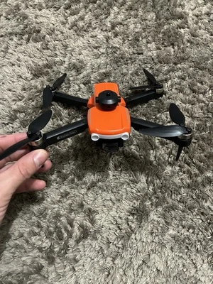 K102 MAX Intelligent Obstacle Avoidance Drone 2023 Model Orange  (used one time) - Image 1 of 4