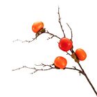 Brighten up your space with this realistic simulated persimmon fruit branch