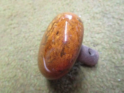 Vintage Porcelain 2 1/4 “ Round Redish Brown Single door knob - Image 1 of 4