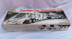 PRESTIGE CAR TRANSPORT AUTO MOVERS - PETERBILT + TRAILER - KIT REVELL 1/25 - NEW - Imagen 1 de 3