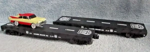 2 Lionel Route 66 Flatbed Cars 9823-1 & 9823-3 With 1 Automobile - Picture 1 of 3