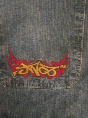 Vintage JNCO Jeans Red And Yellow Tribal Patch Mens 33 Blue Jeans Wide Leg. - Image 1 of 4