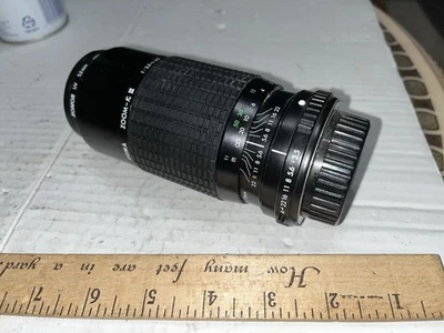 Lente de cámara con recubrimiento múltiple Sigma Zoom K III 1:3,5-4,5 F=75-210 mm 52 Foto 1 de 4