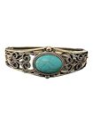 South Western Style Silver Toned Hinged Bracelett With Turquoise Center