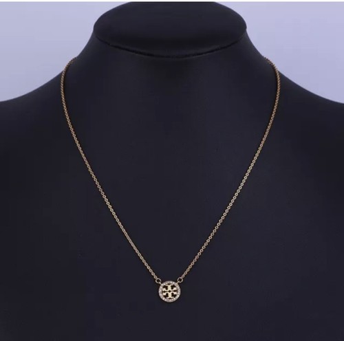 Collana originale Tory Burch Miller con pavimentazione cristalli e logo color oro. Nuovo