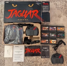 Boxed Atari Jaguar Console with 8 Games, spare controller and instructions.