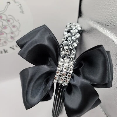 30% de descuento diadema niña/mujer princesa negra y plateada con diseño de trenza bling y arco Foto 1 de 4