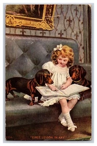 Vintage 1909 Girl Reading With Dogs "First Lesson In Art" Webber Kansas Postcard - Bild 1 von 2