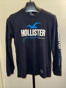Hollister Manga Larga Talla Pequeña Estampado Gráfico Negro Los Ángeles Brilla en la Oscuridad - Imagen 1 de 10