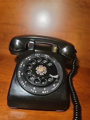 Teléfono negro giratorio adornado con campana eléctrica occidental vintage Foto 1 de 4