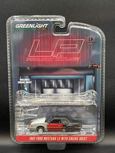 Greenlight 1987 Ford Mustang LX mit Hoist Black Project LP Exclusive 1:64 Diecast - Bild 1 von 4