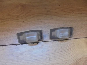 MAZDA 323F 1999-2003 HATCH PAIR OF REAR NUMBER PLATE LIGHT CASES - Picture 1 of 3