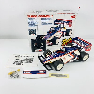 Dickie Taiyo Turbo Formel 1 RC Fahrzeug Super Fight Ferngesteuert Teildefekt - Bild 1 von 4