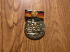 DDR GERMAN FOR SERVICES IN THE FOUNDING AND CONTINUING OF THE GDR MEDAL (M105)