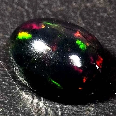 NATURAL AAA+ GENUINE COLOR PLAY OVAL CABOCHAN  ETHIOPIAN WELO BLACK OPAL 1.50CTS - Image 1 of 3