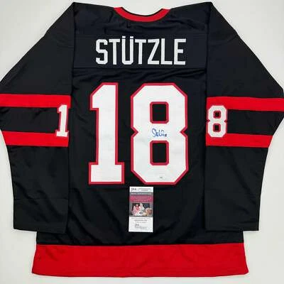 Autographed/Signed Tim Stutzle Ottawa Black Hockey Jersey JSA COA - Image 1 of 4