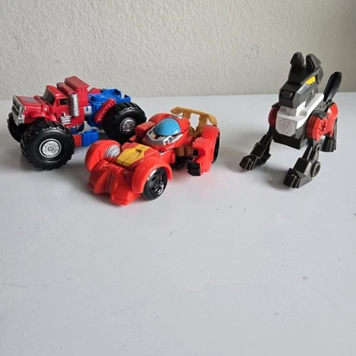 Playskool Heroes Transformers Rescue Bot Academy Optimus Prime Hot Shot K9 Growl - Image 1 of 4