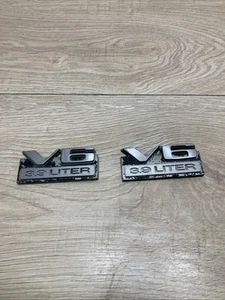 1987-1996 DODGE DAKOTA V6 3.9 LITER EMBLEM LOGO BADGE MOPAR SET OF 2 OEM - Picture 1 of 4
