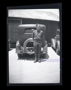 BLACK & WHITE NEGATIVE * Soldier standing behind parked car 1920's? - Picture 1 of 3