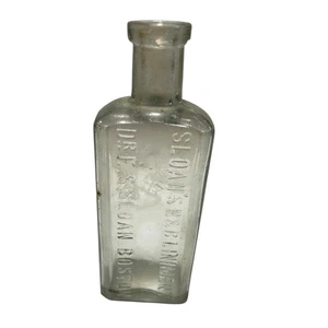Antiguo Sloan's N & B Liniment Dr. E.S. Botella transparente Sloan Boston en relieve - Imagen 1 de 12