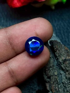 Faceted Ethiopian Black Opal Gemstone:  Round Multi Fire Opal (10x6mm) - Picture 1 of 8