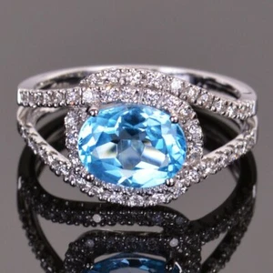 Blue Topaz and Diamond Infinity Ring - Picture 1 of 4