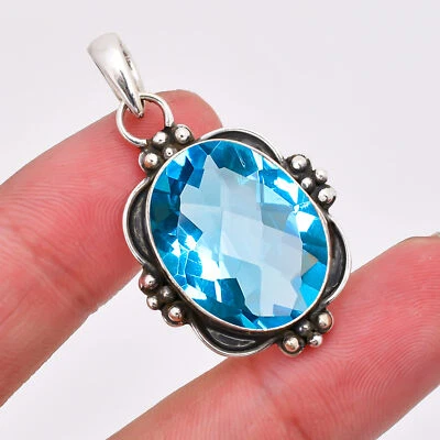 Delicado colgante de joyería de plata de ley 925 con piedras preciosas de topacio azul, colgante oxidado Foto 1 de 4