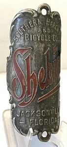 antique early SHEBICO bicycle HEAD BADGE tag Southern Hardware Jacksonville, FLA - Picture 1 of 2