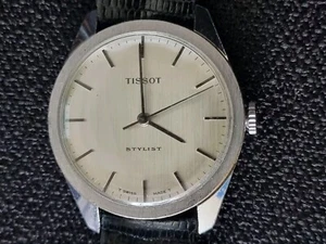 TISSOT STYLIST UHR HANDAUFZUG SILBERGRAUES LEINENZIFFERBLATT UND BRAUNES LEDERARMBAND - Bild 1 von 9