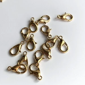 20X broches de garra de langosta color dorado aleación metal 12x6 mm broche de búsqueda de joyas - Imagen 1 de 9