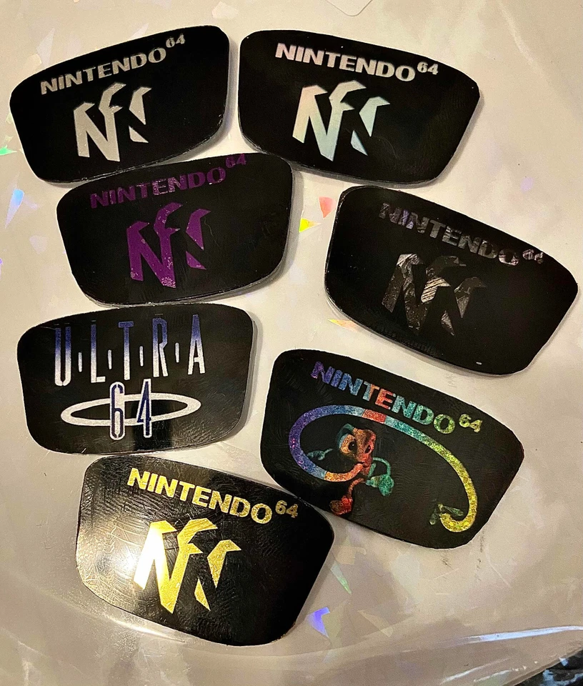 Consola Nintendo 64 N64 Personalizada Logo Joya Emblema Acrílico Cromo Holo - Elige 1 Foto 1 de 1