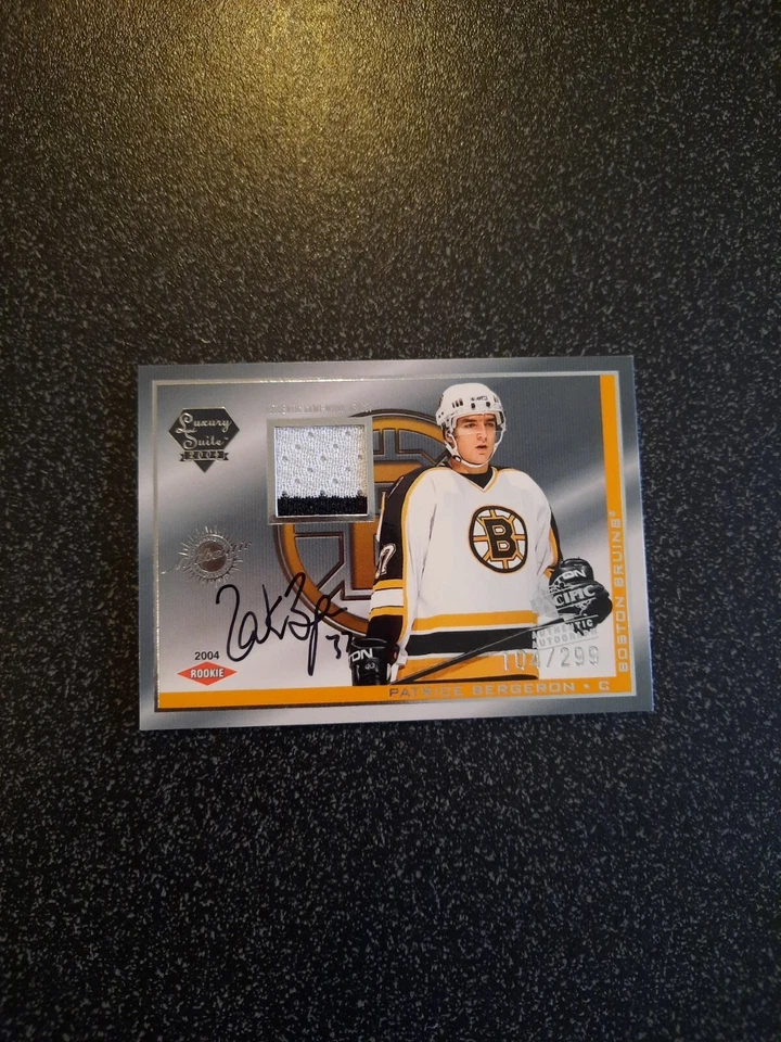 2003-04 Pacific Luxury Suite Patrice Bergeron Rookie Jersey Patch Auto #104/299 - Image 1 of 3