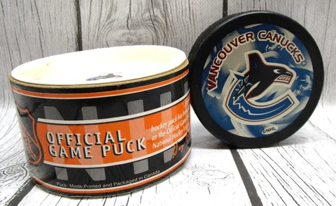 Vancouver Canucks Official Logo NHL Game Hockey Puck in Original Package Cover