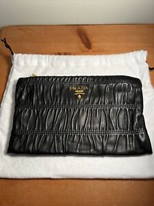 Prada Nappa Gaufre Leather Clutch Black and Gold with a Light Interior