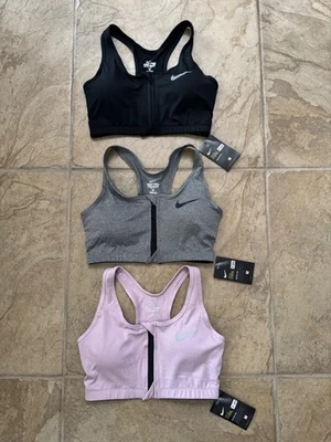 3 PARES DE SUJETADORES DEPORTIVOS NIKE PRO COMBAT DRI-FIT DELANTEROS CON CREMALLERA PARA MUJER TALLA M Foto 1 de 2