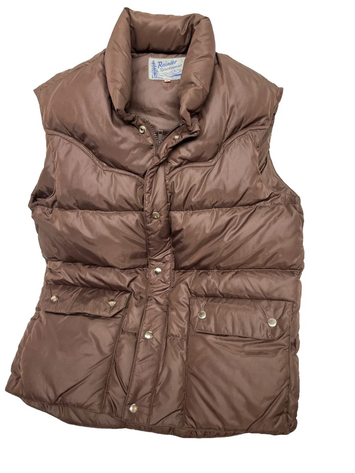 Chaleco aislante de plumón marrón vintage años 80 Rainier ropa deportiva para hombre pequeño acolchado Foto 1 de 4