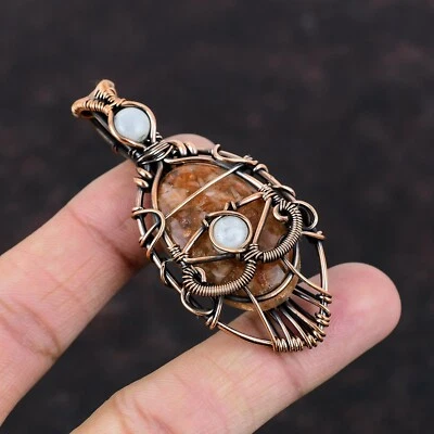 Piedra solar de cobre piedra preciosa arco iris piedra lunar alambre envuelto mal de ojo colgante joyería Foto 1 de 4